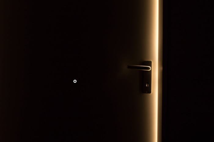 a dark room and a door