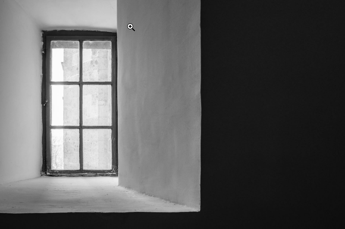 black and white shot of a window